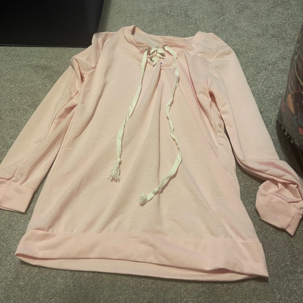 Light pink long sleeve shirt with white crisscross design